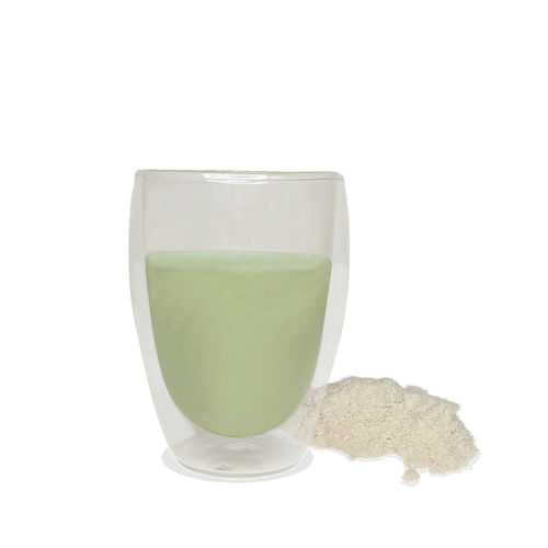 NutriBrown Rice 100% Plant-Based Prebiotic Drink in Avocado flavour, poured into a cup with the powder beside it.